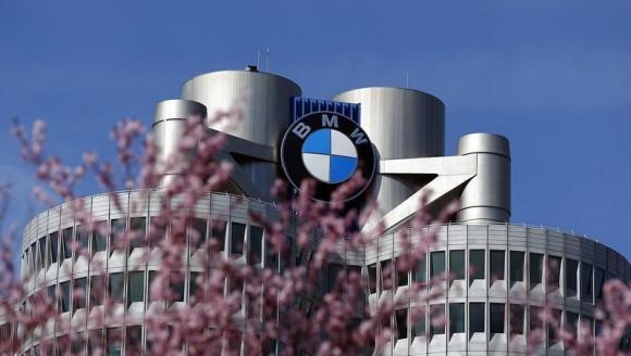 Trees bloom in front of the headquarters of German luxury car maker BMW in Munich March 18, 2014. REUTERS/Michael Dalder