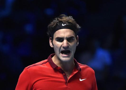 Roger Federer of Switzerland reacts during his semi-final tennis match against compatriot Stanislas Wawrinka at the ATP World Tour Finals at the O2 Arena in London November 15, 2014. REUTERS/Toby Melville