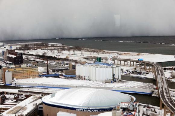 A lake-effect snow storm with freezing temperatures produces a wall of snow travelling over Lake Erie into Buffalo, New York. November 18, 2014. CREDIT: REUTERS/GARY WIEPERT
