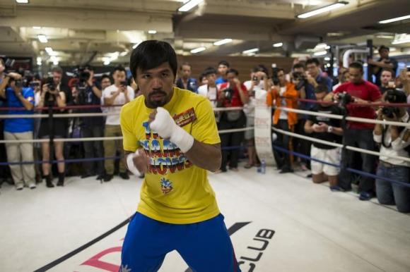 Boxer Manny Pacquiao of the Philippines trains during a media workout in Hong Kong October 27, 2014. CREDIT: REUTERS/TYRONE SIU