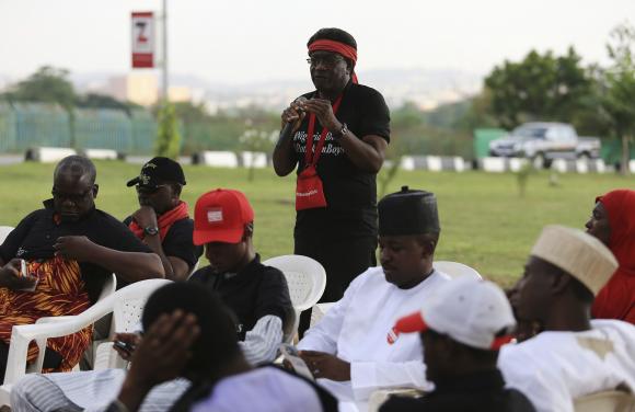 A BringBackOurGirls campaigner speaks during a mourning session at the Unity fountain in Abuja, for victims of a suicide bomb attack in Potiskum, November 14, 2014. CREDIT: REUTERS/AFOLABI SOTUNDE