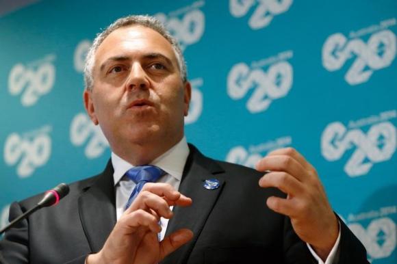 Australia's Treasurer Joe Hockey holds a news conference after a meeting of G-20 finance ministers and central bank governors during the IMF-World Bank annual meetings in Washington October 10, 2014. CREDIT: REUTERS/JONATHAN ERNST