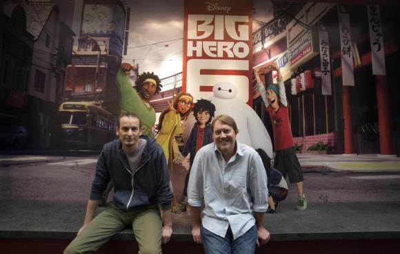Directors of the animated movie 'Big Hero 6' Don Hall (R) and Chris Williams pose for a portrait at Disney Animation Studios in Burbank, California September 29, 2014. CREDIT: REUTERS/MARIO ANZUONI
