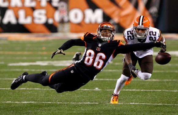 Cincinnati Bengals wide receiver James Wright (86) is unable to make a catch while being defended by Cleveland Browns cornerback Buster Skrine (22) during the second half at Paul Brown Stadium. The Browns won 24-3. Aaron Doster-USA TODAY Sports