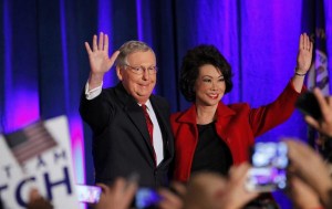 Mitch McConnell waves to supporters with his wife, former United States Secretary of Labor Elaine Chao, at his midterm election night rally in Louisville, Kentucky, November 4, 2014. REUTERS/John Sommers II
