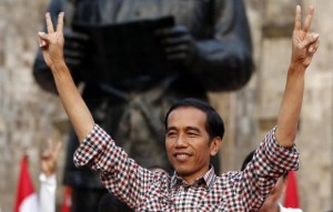 Indonesian presidential candidate Joko "Jokowi" Widodo gestures during a rally in Proklamasi Monument Park in Jakarta in this July 9, 2014 file photo. REUTERS/Darren Whiteside/Files