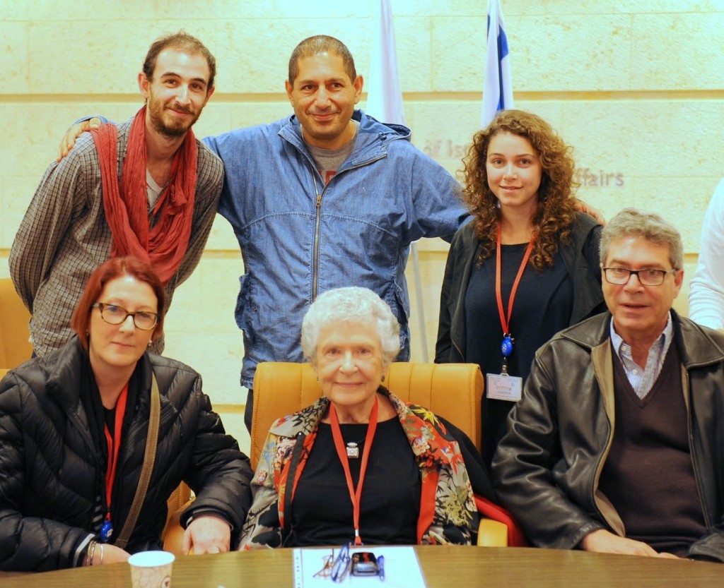 Journey in a time machine. Accompanied by her family in Israel, Margot Cassel-Pins (seated, center) shares her memories of the Philippines as a young student and refugee, in a video conference to the student assembly of the Philippine Women’s University.