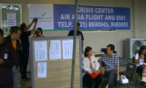 A crisis center set up in Indonesia for relatives of the 162 passengers of the missing Air Asia flight. (photo grabbed from Reuters video/Courtesy Reuters)