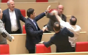 Georgian politicians throw punches during a parliament session as debate on party quotas grows heated. (Photo grabbed from Reuters video/Courtesy Reuters)