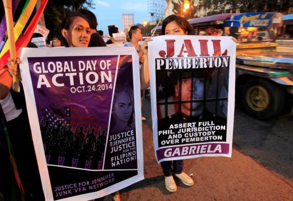 Protesters display banners seeking justice for murdered Filipino transgender Jeffrey Laude, who also goes by the name Jennifer, during a protest along a main street of Manila October 24, 2014. CREDIT: REUTERS/ROMEO RANOCO