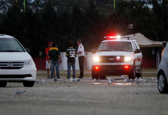 Dec 21, 2014; Tampa, FL, USA; Safety officials work the scene after several fans were injured by getting stuck by lightning after the game between the Tampa Bay Buccaneers and Green Bay Packers at Raymond James Stadium. Mandatory Credit: Kim Klement-USA TODAY Sports