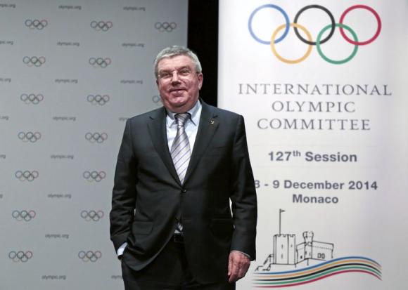 International Olympic Committee (IOC) President Thomas Bach smiles following a news conference as part of the IOC Executive Board meeting in Monaco December 6, 2014. CREDIT: REUTERS/ERIC GAILLARD