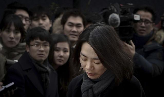 Cho Hyun-ah, also known as Heather Cho, daughter of chairman of Korean Air Lines, Cho Yang-ho, appears in front of the media outside the offices of the Aviation and Railway Accident Investigation Board of the Ministry of Land, Infrastructure, Transport, in Seoul December 12, 2014. CREDIT: REUTERS/SONG EUN-SEOK/NEWS1 (SOUTH KOREA