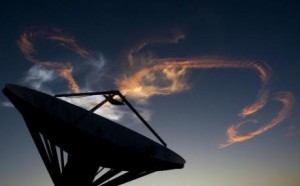 The smoke trail from the launch of the space shuttle Discovery STS-131 is illuminated by the rising sun at the Kennedy Space Center in Cape Canaveral, Florida