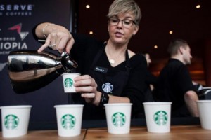 Sandy Roberts pours samples of Starbucks Reserve Sun Dried Ethiopia Yirgacheffe coffee during the company's annual shareholders meeting in Seattle
