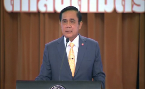 Thai Prime Minister Prayuth Chan-ocha says in a year-end speech that martial law will hold and general elections will have to wait, in order to bring stability to the country. (Photo grabbed from Reuters video)