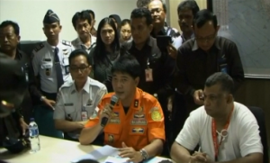 Spokesperson of National Search and Rescue Agency Mochamad Hernanto explaining to reporters the details of the search operations for the missing Air Asia plane carrying 162 people from the Indonesian city of Surabaya.