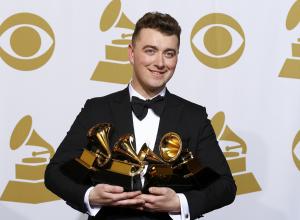 Sam Smith poses with his awards for Best New Artist, Best Pop/Vocal Album for "In the Lonely Hour" and Song of the Year and Record of the Year for "Stay With Me" in the press room at the 57th annual Grammy Awards in Los Angeles, California February 8, 2015.   REUTERS/Mike Blake