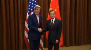 U.S. Secretary of State John Kerry meets Chinese Foreign Minister Wang Yi in Beijing amidst simmering tensions over disputed areas of the South China Sea.  (Photo grabbed from Reuters video/Courtesy Reuters)