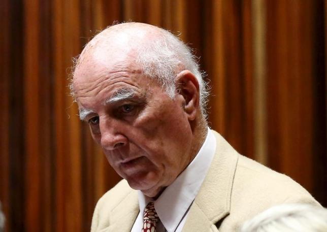 Former Grand Slam doubles champion Bob Hewitt looks on ahead of court proceedings at the  South Gauteng High Court in Johannesburg February 10, 2015.  REUTERS/Siphiwe Sibeko