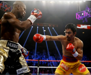 Floyd Mayweather defeats Manny Pacquiao in a 12 round unanimous decision to improve his career record to 48-0. (Courtesy USA Today sports images)