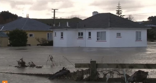 Torrential rain causes Whanganui river to burst its banks in New Zealand, flooding parts of the district. REUTERS
