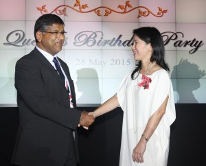 British Ambassador confers the MBE award to Victoria Buenaventura on behalf of Her Majesty Queen Elizabeth II.