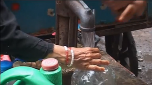 Karachi's ongoing acute water shortage is exacerbated after a deadly heat wave, forcing many residents to collect from illegal sources. (A photo grabbed from Reuters video)