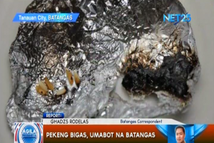 The "fake" rice found in Batangas melted when it was burned and turned black when it solidified (Photo grabbed from video taken by ENS Batangas correspondent Ghadz Rodelas)