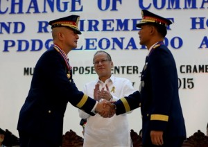 President Benigno S. Aquino III witnesses the change of command ceremony of Philippine National Police with former PNP Officer-in-Charge and Deputy Director General Leonardo Espina ceding to newly appointed Chief Police Director Ricardo Marquez the symbolic Transformation Torch during the PNP Change of Command Ceremony and Retirement Honors for P/DDG Leonardo Espina at the Multi-Purpose Center, Camp Crame in Quezon City on Thursday (July 16). (Photo by Benhur Arcayan / Malacañang Photo Bureau)