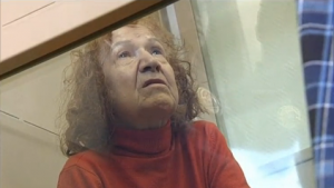 A 68-year-old Russian woman, suspected of killing and dismembering at least two people but feared of murdering 11 more, is arrested by Russian authorities.  (Photo grabbed from Reuters video)