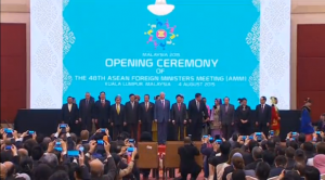 Various foreign ministers of ASEAN standing on stage for a group photo during the regional bloc meet for three-day talks in Malaysia on Tuesday (Aug. 4, 2015) (Photo grabbed from Reuters video)