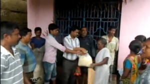 Relief materials are distributed to flood victims in India's eastern states of West Bengal and Odisha, after at least 75 people lost their lives due to heavy rains. (Courtesy Reuters/Photo grabbed from Reuters video)