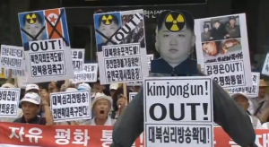 South Korean protesters rally against North Korea in Seoul after the North's leader Kim Jong Un ordered troops on war footing following an exchange of fire with South.  (Courtesy Reuters/photo grabbed from Reuters video)