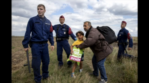 Camerawoman_allegedly_trips_up_fleeing_migrants_in_Hungary_001