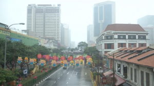 Singapore residents hope downpour will bring respite from haze from forest fires in Indonesia choking the city-state. (Courtesy Reuters/Photo grabbed from Reuters video)