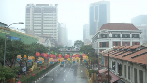 Singapore residents hope downpour will bring respite from haze from forest fires in Indonesia choking the city-state.  (Courtesy Reuters/Photo grabbed from Reuters video)