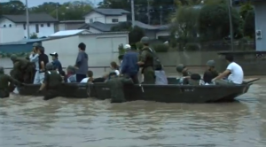 Military rescue boats ferry people evacuating from the flooded areas. (Courtesy Ministry of Defense/Joint Staff/Photo grabbed from video provided by Reuters)