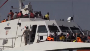 A crowded Turkish coastguard ship carrying rescued people to shore. (Photo grabbed from Reuters video)