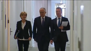 Malcolm Turnbull, (C), Foreign Minister Julie Bishop and Education Minister Christopher Pyne walking in the corridor of Parliament House. (Courtesy Australian Broadcasting Corporation/Photo grabbed from video provided by Reuters)
