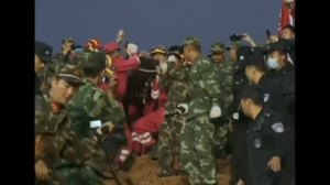 One man was pulled out alive early Wednesday morning, 67 hours after a massive landslide hit China's southern city of Shenzhen. (Photo captured from CCTV video)