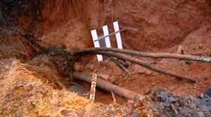 Severe weather causes flooding across the Southern United States and leads to road collapse in South Carolina and barge sinking in Mississippi. (Photo captured from Reuters video)