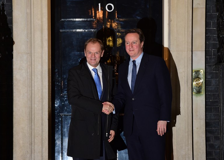 British Prime Minister David Cameron (R) greets European Council President Donald Tusk outside No 10 Downing Street in central London on January 31, 2016, ahead of their meeting. Prime Minister David Cameron is to propose curbing the benefits European Union migrants can claim in negotiations with EU president Donald Tusk ahead of a referendum on whether Britain should leave the bloc. Under Cameron's proposal, an "emergency brake" to in-work benefits would come into force immediately after the referendum, due to be held by 2017.  / AFP / Leon Neal