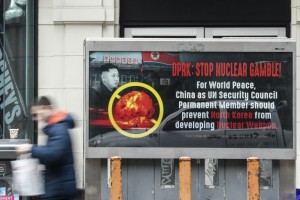 A posted advertisement that reads : "DPRK: STOP NUCLEAR GAMBLE!" is displayed on a street near Times Square in New York on February 9,2016. The ad has put up by Ted Han, head of Bridge Enterprises, a Korean-American businessman. The UN Security Council strongly condemned North Korea's rocket launch on February 7, 2016 and agreed to move quickly to impose new sanctions that will punish Pyongyang for "these dangerous and serious violations." / AFP / KENA BETANCUR