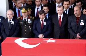 Turkey's Chief of Staff General Hulusi Akar (2nd L), Turkey's Prime Minister Ahmet Davutoglu (C) and Turkey's President Recep Tayyip Erdogan (2nd R) look on during the funeral ceremony for Army Officer Seckin Cil in Ankara, on February 18, 2016 who was killed during an operation in Sur district of the southeastern city of Diyarbakir. / AFP / ADEM ALTAN