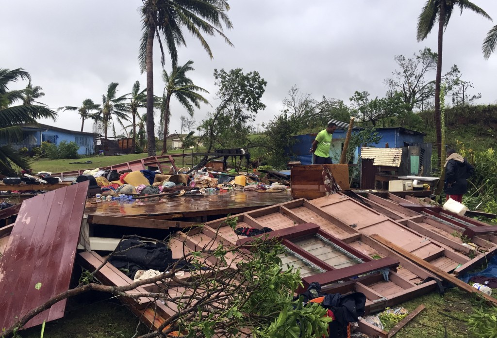 This handout photo taken by Naziah Ali of MaiLife Magazine on February 21, 2016 shows a family digging through the remains of their home in the town of Ba, after it was destroyed by severe tropical cyclone Winston, the only category five storm system to ever hit Fiji. Fiji began a massive clean-up on February 21 after the most powerful cyclone in its history battered the Pacific island nation, killing at least one person and leaving a trail of destruction.  AFP PHOTO / NAZIAH ALI / MAILIFE MAGAZINE   ----EDITORS NOTE ----RESTRICTED TO EDITORIAL USE MANDATORY CREDIT " AFP PHOTO / NAZIAH ALI / MAILIFE MAGAZINE " NO MARKETING NO ADVERTISING CAMPAIGNS - DISTRIBUTED AS A SERVICE TO CLIENTS - NO ARCHIVES / AFP / MAILIFE MAGAZINE / NAZIAH ALI