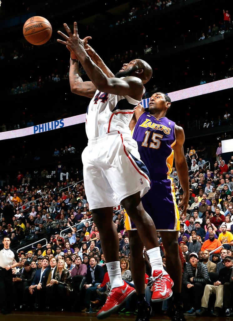 ATLANTA, GA - MARCH 13: Ivan Johnson #44 of the Atlanta Hawks battles for a rebound against Metta World Peace #15 of the Los Angeles Lakers at Philips Arena on March 13, 2013 in Atlanta, Georgia. NOTE TO USER: User expressly acknowledges and agrees that, by downloading and or using this photograph, User is consenting to the terms and conditions of the Getty Images License Agreement. Kevin C. Cox/Getty Images/AFP