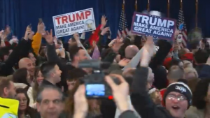 Supporters of Republican presidential frontrunner and billionaire Donald Trump cheering after Trump's victiory in the New Hampshire Republican primary. (Photo courtesy: Reuters/Photo grabbed from Reuters video)