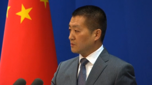 Chinese Foreign Ministry spokesman Lu Kang addresses a daily news briefing. China accuses the United States of seeking maritime "hegemony" in the name of freedom of navigation after a U.S. Navy destroyer sailed within 12 nautical miles of a disputed island in the South China Sea. (Courtesy Reuters/Photo grabbed from Reuters video)