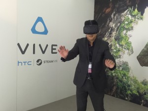 The author tries on the Virtual Reality headset of HTC which is currently on display at the Mobile World Congress 2016 in Barcelona, Spain. (Eagle News Service)